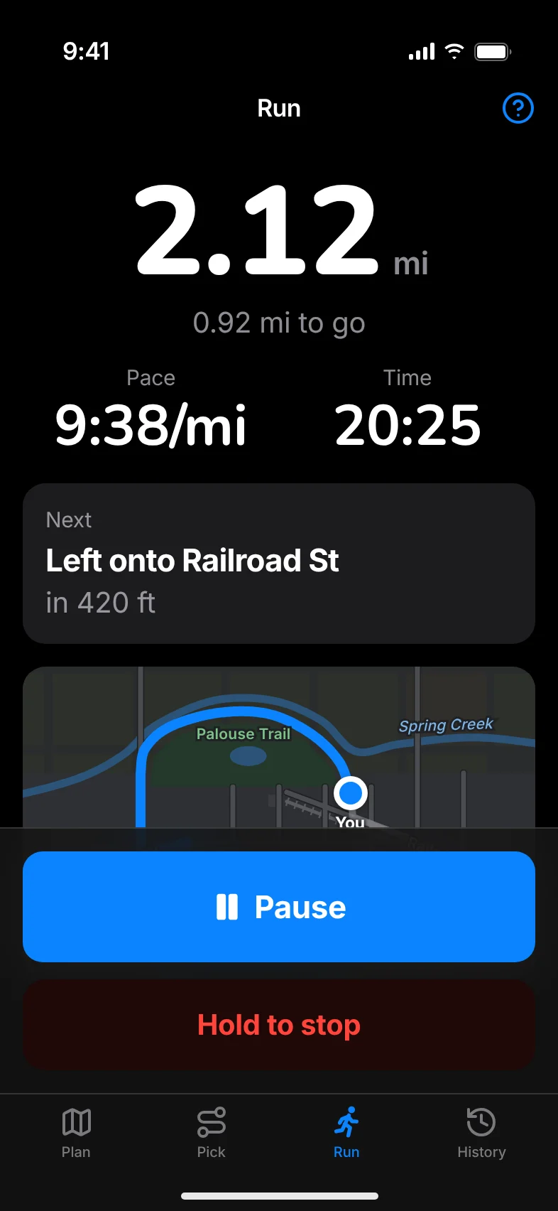 The Run screen: 2.12 miles, 0.92 to go, pace and time, the next turn and Pause and Hold to stop buttons.