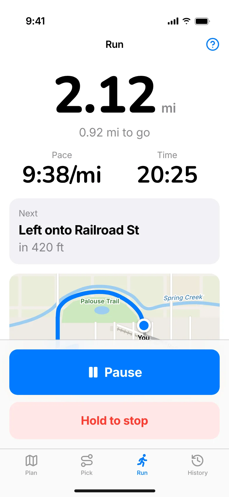 The Run screen: 2.12 miles, 0.92 to go, pace and time, the next turn and Pause and Hold to stop buttons.