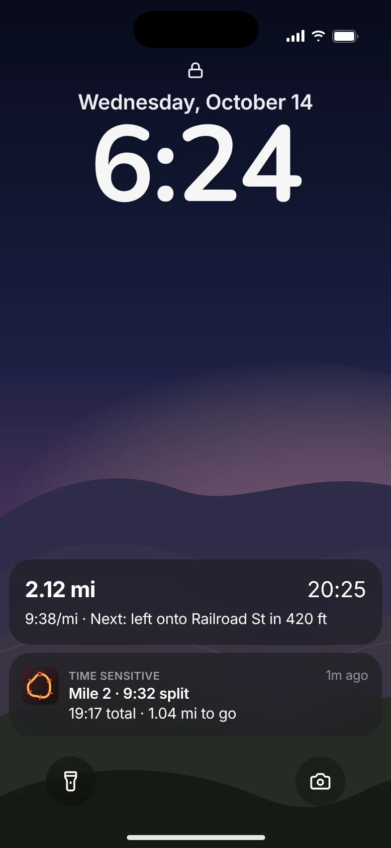 The lock screen during a run, with MileDial's live progress and a Mile 2 split alert.